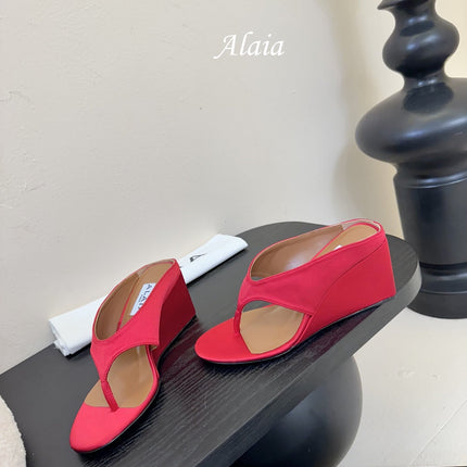 ALAIA WEDGE THONG SANDALS 25S IN RED SATIN