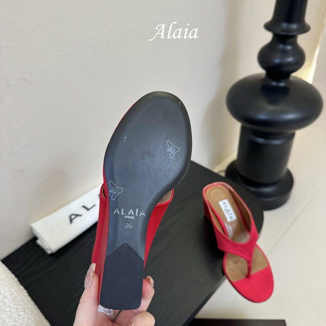 ALAIA WEDGE THONG SANDALS 25S IN RED SATIN