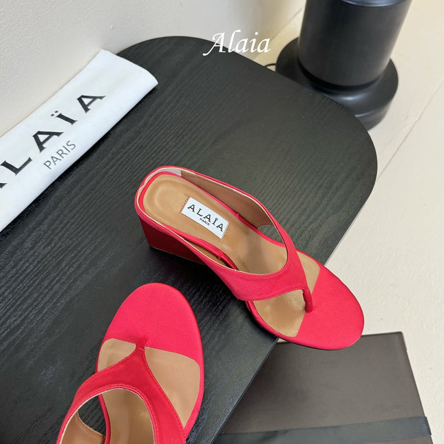 ALAIA WEDGE THONG SANDALS 25S IN RED SATIN