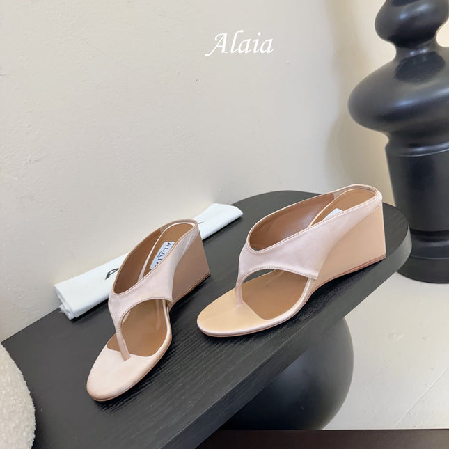 ALAIA WEDGE THONG SANDALS 25S IN BLUSH BEIGE SATIN