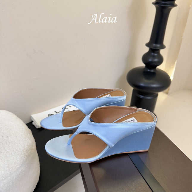 ALAIA WEDGE THONG SANDALS 25S IN BLUE SATIN