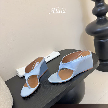 ALAIA WEDGE THONG SANDALS 25S IN BLUE SATIN