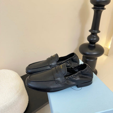 PRADA 25S SHUFFLE LOAFERS IN BLACK CALFSKIN