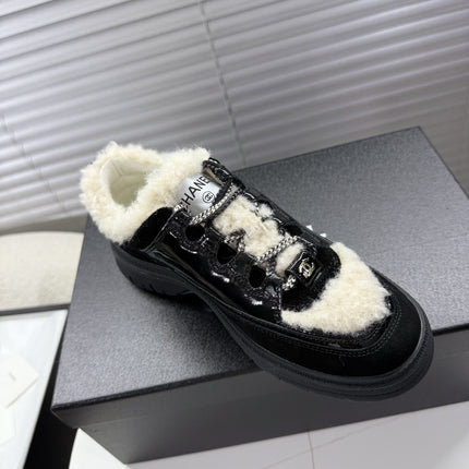 CHANEL 25S SNEAKERS WITH FUR ACCENTS 35MM IN BLACK CALFSKIN