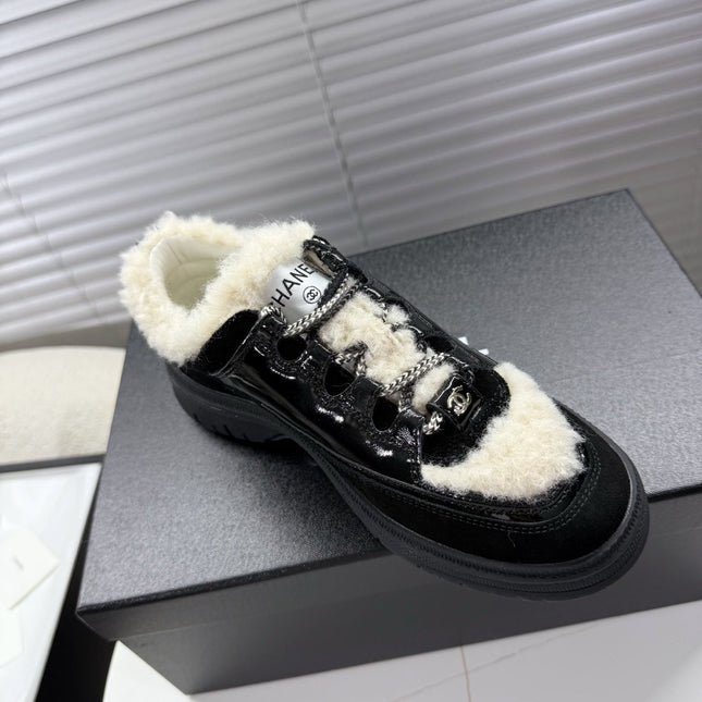 CHANEL 25S SNEAKERS WITH FUR ACCENTS 35MM IN BLACK CALFSKIN