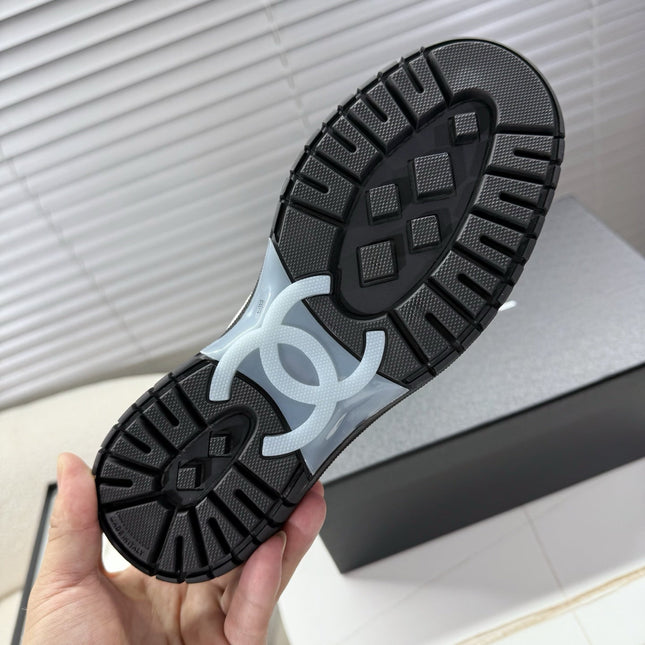 CHANEL 25S SNEAKERS WITH FUR ACCENTS 35MM IN BLACK CALFSKIN