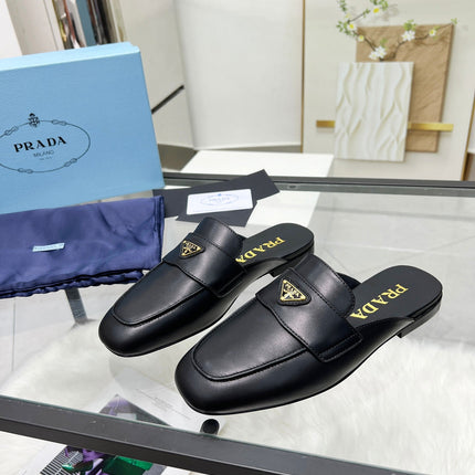 TRIANGLE LOGO MULES IN BLACK CALFSKIN