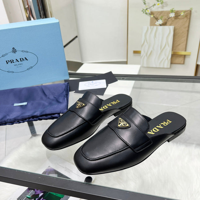 TRIANGLE LOGO MULES IN BLACK CALFSKIN