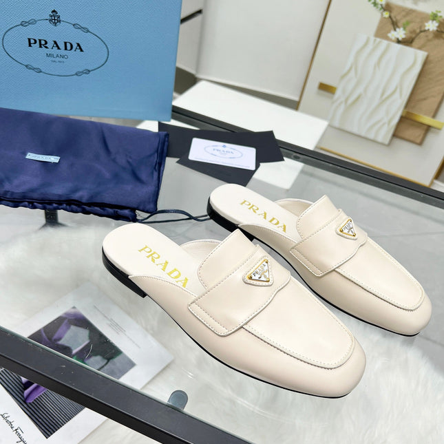 TRIANGLE LOGO MULES IN WHITE CALFSKIN