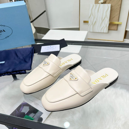 TRIANGLE LOGO MULES IN WHITE CALFSKIN