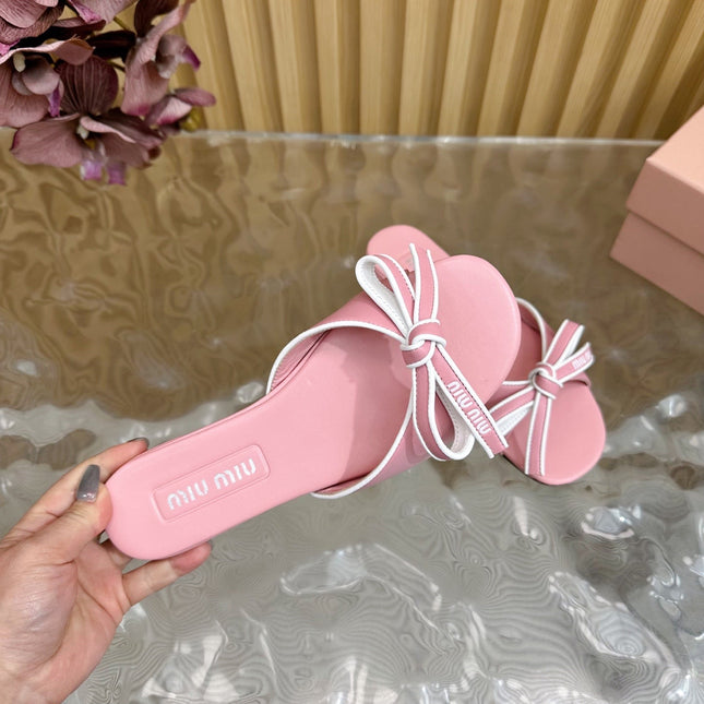 SLIDES SANDALS IN PINK CALFSKIN WITH BOW IN TRAP