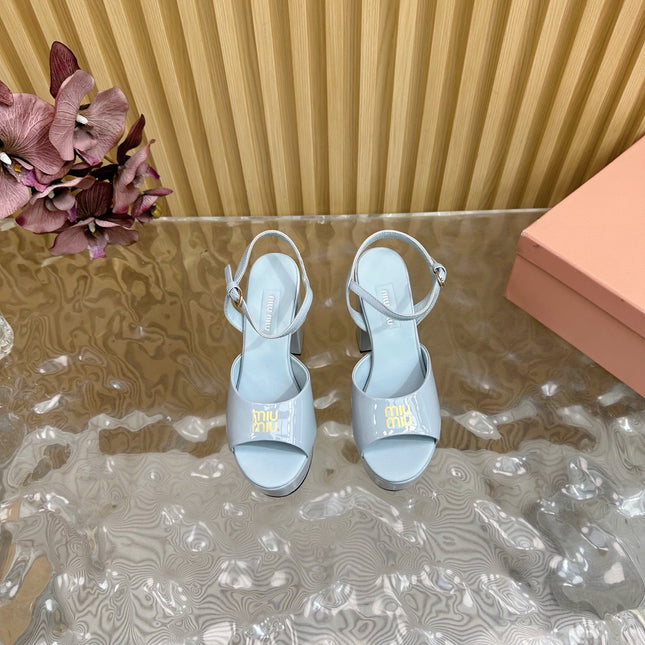 PLATFORM HEELS IN BABY BLUE PATENT CALFSKIN GOLD LOGO IN STRAP