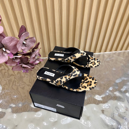 ALAIA PLATFORM THONG SANDALS 25S IN LEOPARD PONY HAIR LEATHER