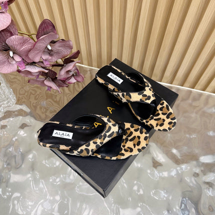 ALAIA PLATFORM THONG SANDALS 25S IN LEOPARD PONY HAIR LEATHER