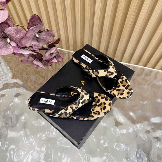 ALAIA PLATFORM THONG SANDALS 25S IN LEOPARD PONY HAIR LEATHER