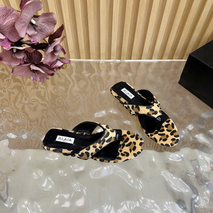 ALAIA PLATFORM THONG SANDALS 25S IN LEOPARD PONY HAIR LEATHER