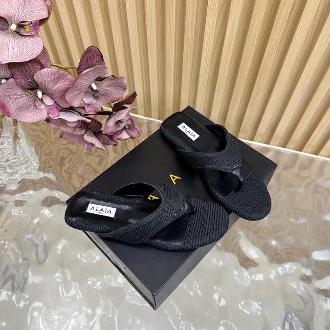 ALAIA PLATFORM THONG SANDALS 25S IN BLACK RAFFIA AND CALFSKIN