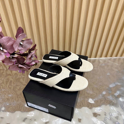 ALAIA PLATFORM THONG SANDALS 25S IN LIGHT BEIGE RAFFIA AND CALFSKIN