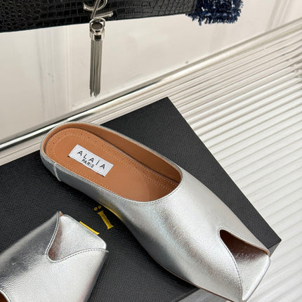 ALAIA FLAT MULE IN SILVER LAMBSKIN