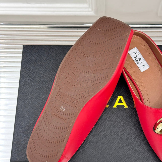 ALAIA FLAT MULE IN CRIMSON RED LAMBSKIN WITH GOLD HARDWARE