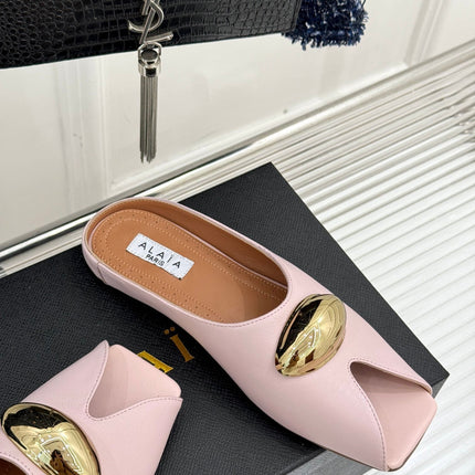 ALAIA FLAT MULE IN LIGHT PINK LAMBSKIN WITH GOLD HARDWARE