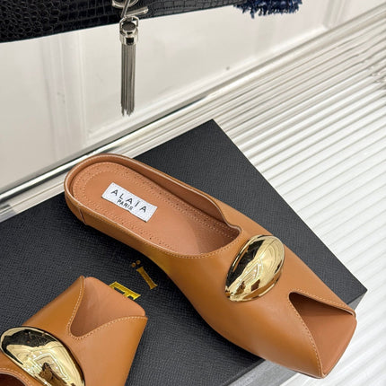 ALAIA FLAT MULE IN BRONZE BROWN LAMBSKIN WITH GOLD HARDWARE