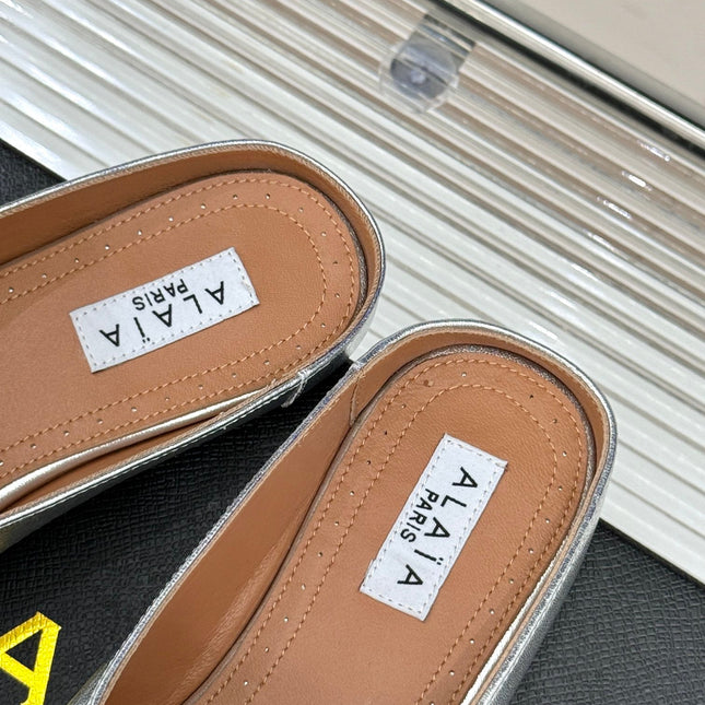 ALAIA FLAT MULE IN SILVER LAMBSKIN WITH SILVER HARDWARE