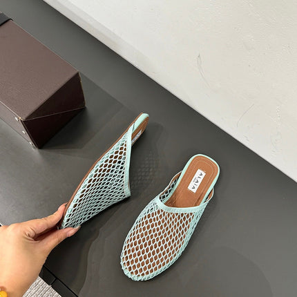 ALAIA FLAT MULES IN LIGHT BLUE MESH FISHNET