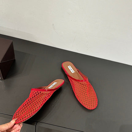 ALAIA FLAT MULES IN CHERRY RED MESH FISHNET
