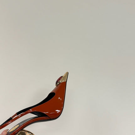 RED GEM-STUDDED SLINGBACK PUMPS IN ORANGE PATENT CALFSKIN
