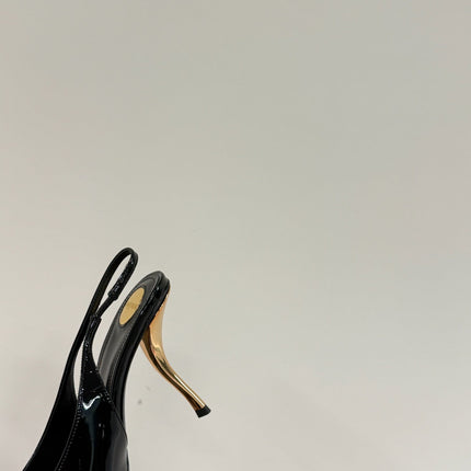 GREEN GEM-STUDDED SLINGBACK PUMPS IN BLACK PATENT CALFSKIN