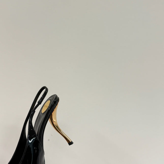 GREEN GEM-STUDDED SLINGBACK PUMPS IN BLACK PATENT CALFSKIN