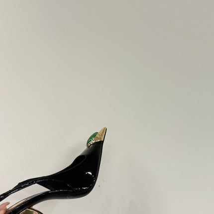 GREEN GEM-STUDDED SLINGBACK PUMPS IN BLACK PATENT CALFSKIN
