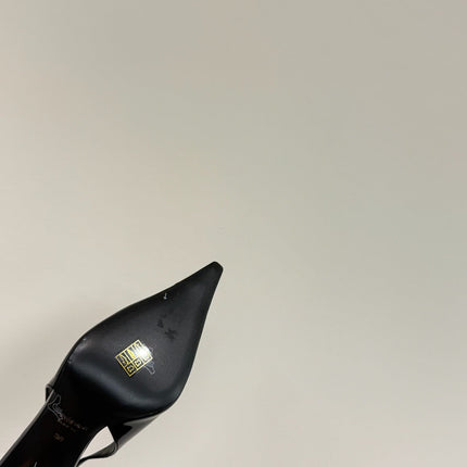 GREEN GEM-STUDDED SLINGBACK PUMPS IN BLACK PATENT CALFSKIN
