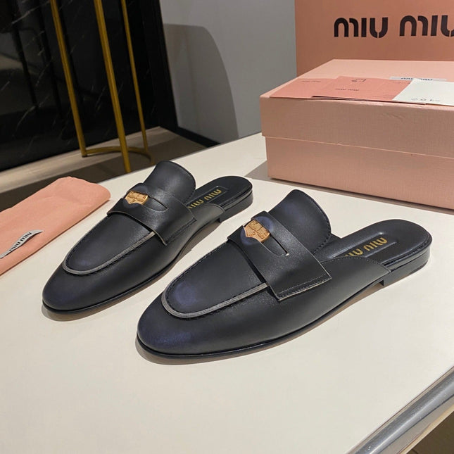 MULES SLIPPERS BLACK COWHIDE WITH GOLD COIN