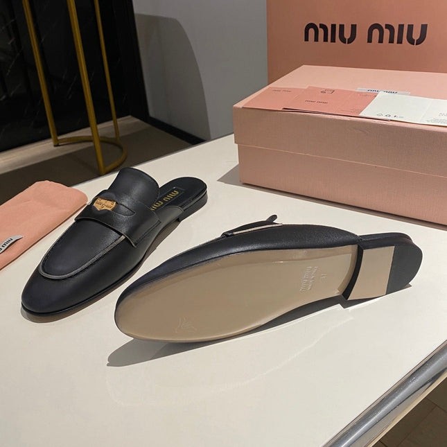 MULES SLIPPERS BLACK COWHIDE WITH GOLD COIN