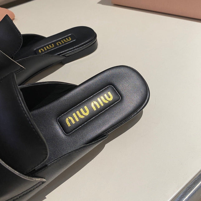 MULES SLIPPERS BLACK COWHIDE WITH GOLD COIN