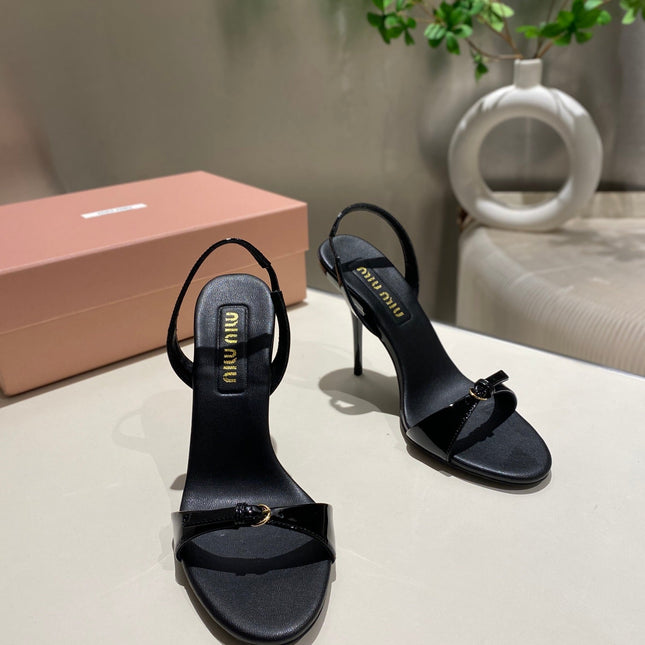 TWO STRAP HIGH HEELED SANDALS IN BLACK GLOSSY SHEEPSKIN