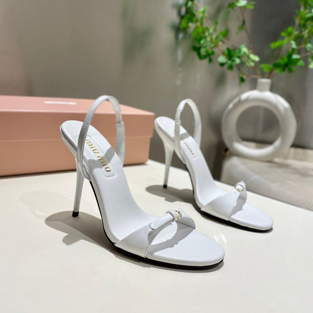 TWO STRAP HIGH HEELED SANDALS IN WHITE GLOSSY SHEEPSKIN