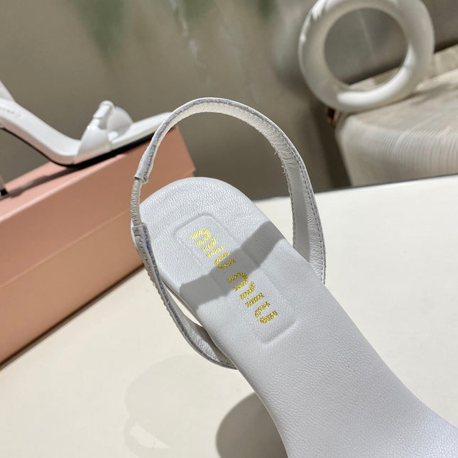 TWO STRAP HIGH HEELED SANDALS IN WHITE GLOSSY SHEEPSKIN