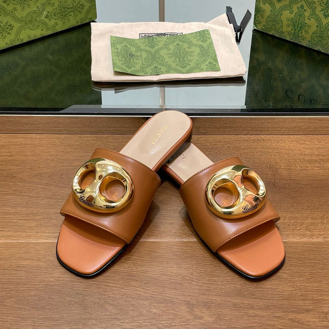 FLAT MULE IN BRONE BROWN CALFSKIN WITH GOLD HARDWARE