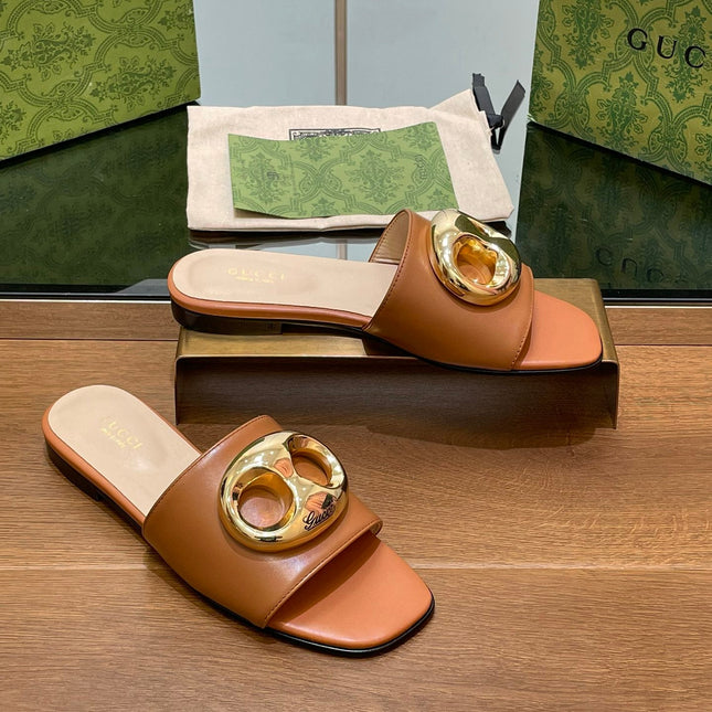 FLAT MULE IN BRONE BROWN CALFSKIN WITH GOLD HARDWARE