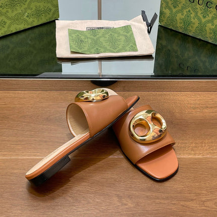 FLAT MULE IN BRONE BROWN CALFSKIN WITH GOLD HARDWARE