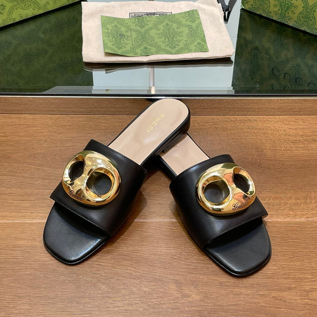 FLAT MULE IN BLACK CALFSKIN WITH GOLD HARDWARE