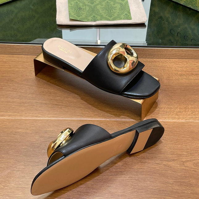 FLAT MULE IN BLACK CALFSKIN WITH GOLD HARDWARE