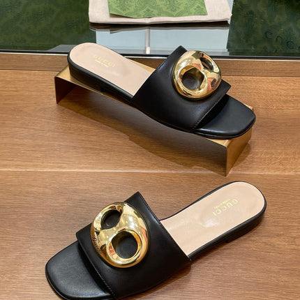 FLAT MULE IN BLACK CALFSKIN WITH GOLD HARDWARE