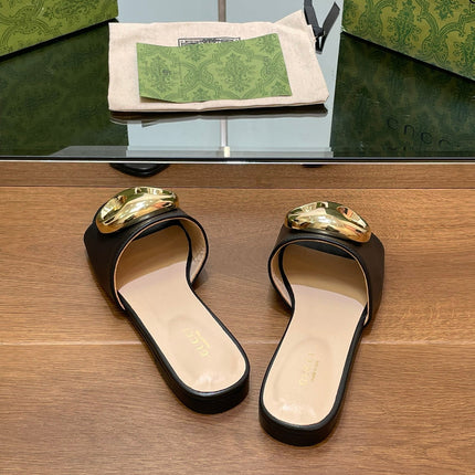 FLAT MULE IN BLACK CALFSKIN WITH GOLD HARDWARE