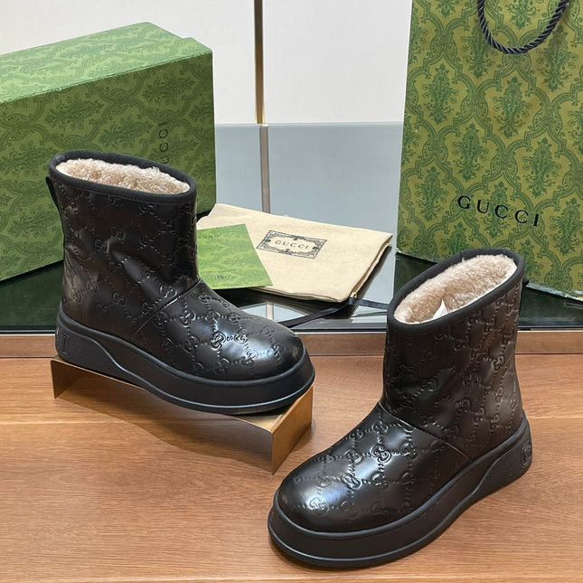 GG UGG BOOTS IN BLACK EMBOSSED DEERSKIN AND BEIGE WOOL LINING