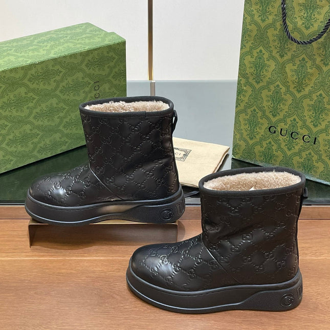 GG UGG BOOTS IN BLACK EMBOSSED SUEDE AND BEIGE WOOL LINING
