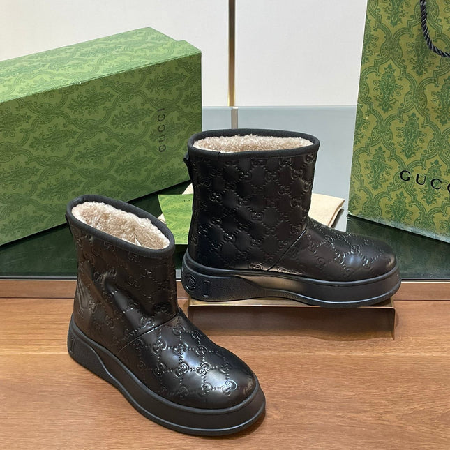 GG UGG BOOTS IN BLACK EMBOSSED SUEDE AND BEIGE WOOL LINING